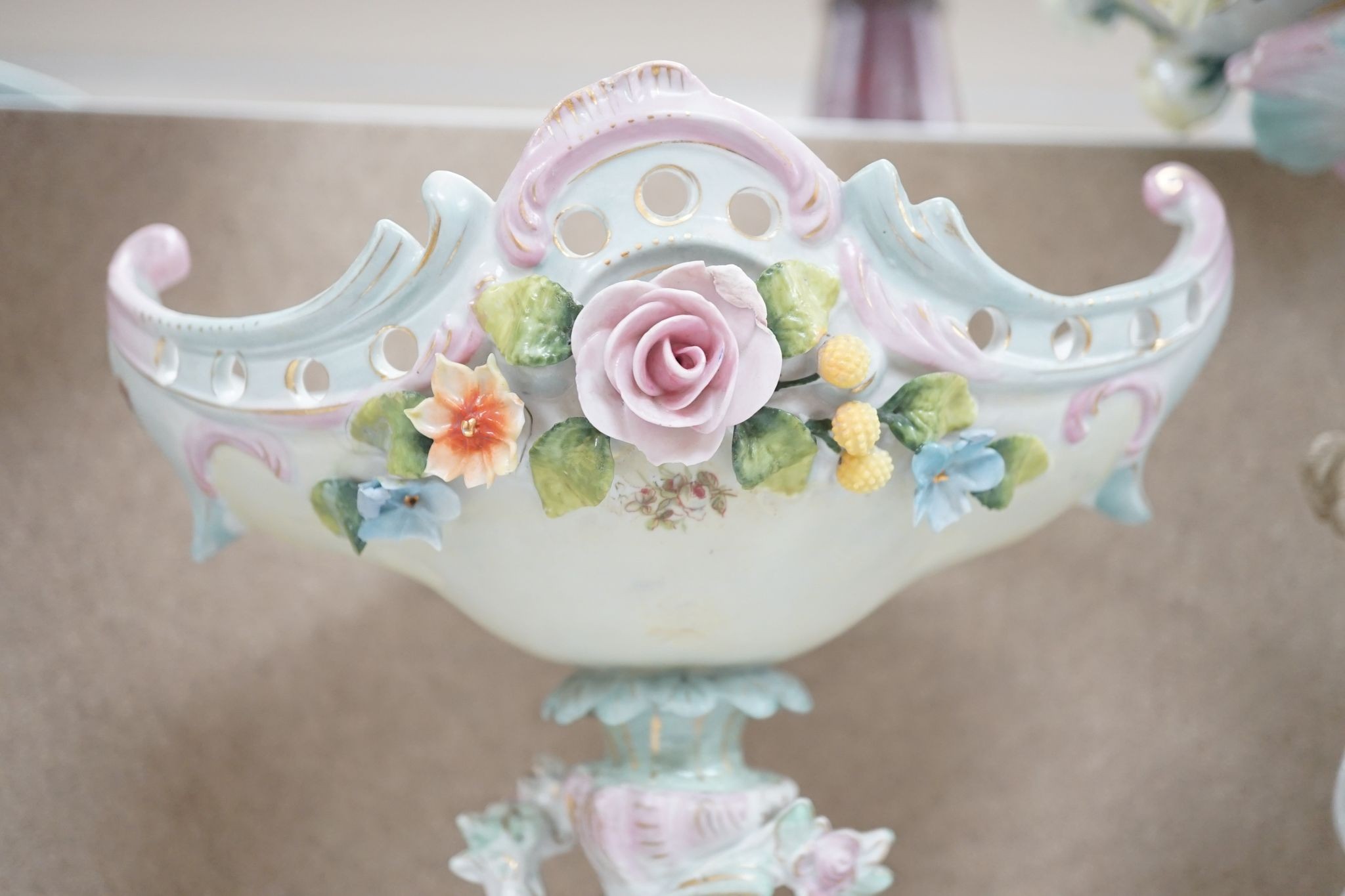 A tall German porcelain figural centrepiece bowl and two others smaller. Tallest 47cm